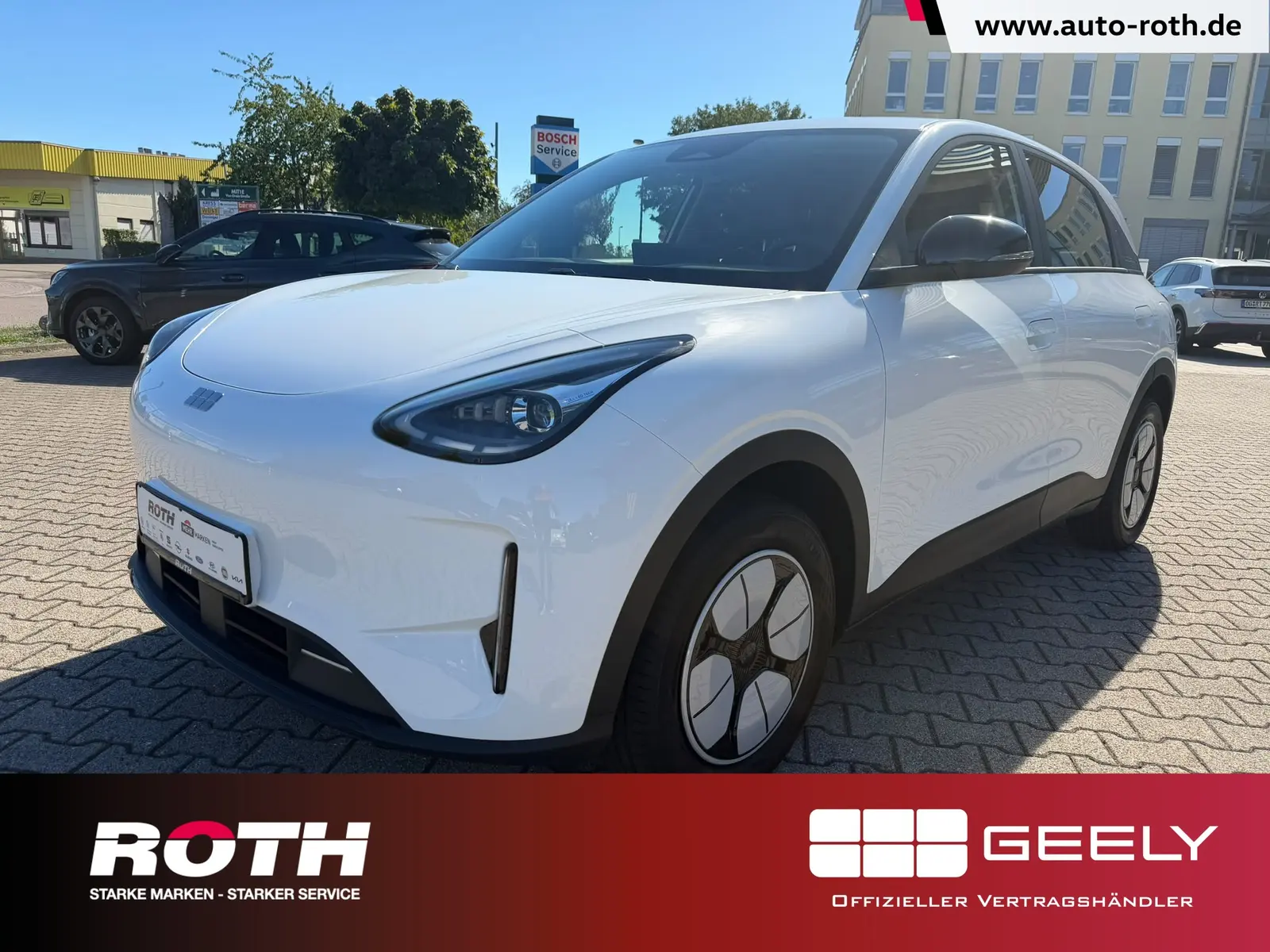 Geely E2 85 kW 14 kwh automat, biela, 99 km, Nemecko — foto 1